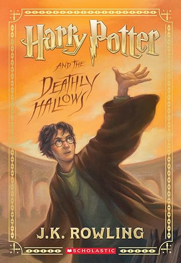 Harry Potter & The Deathly Hallows by. J.K. Rowling